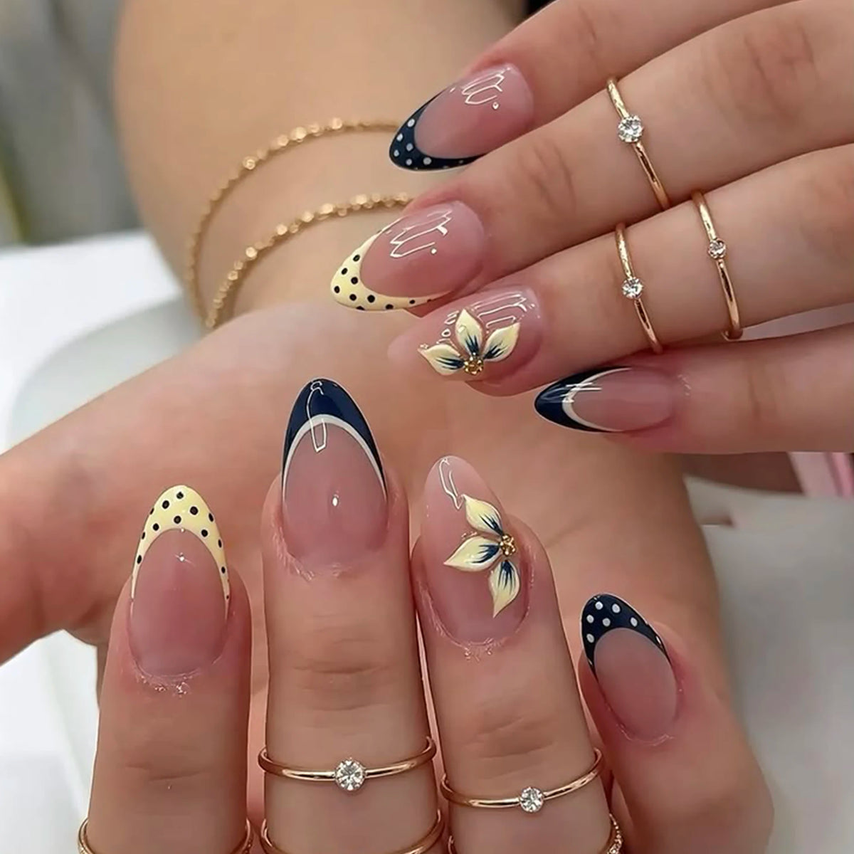 24 Handmade Almond Press-On Nails. Sheer Nude Base, Navy French Tips with White Polka Dots, Yellow Polka Dot Tips & Hand-Painted